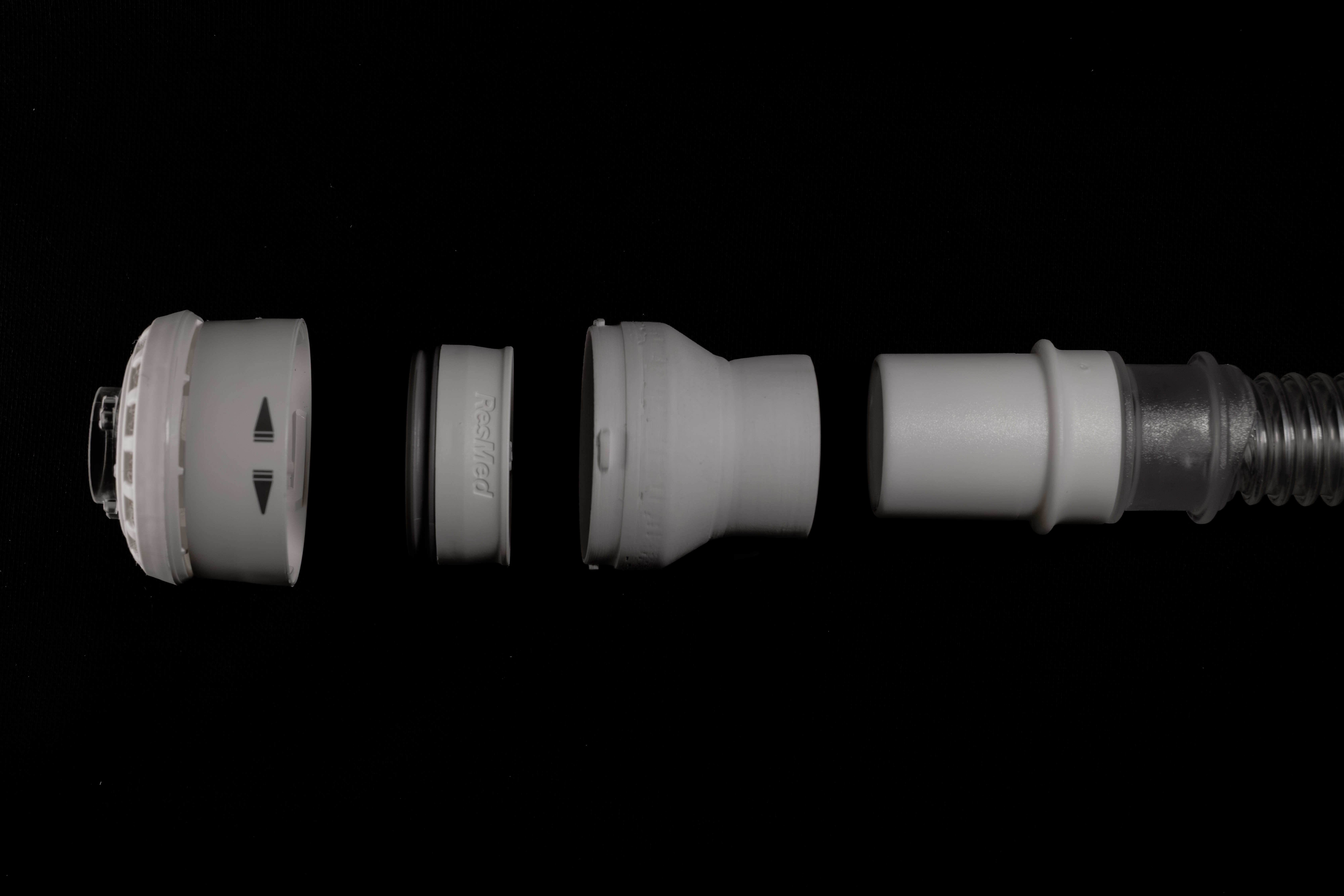 Exploded view showing all components in sequence: diffuser, adapter, connector, and hose